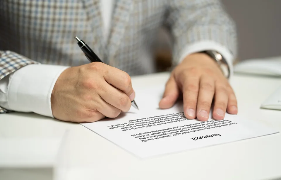 Marked-up agreement with fountain pen