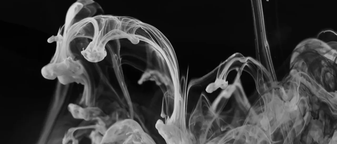 Ink dispersing slowly in water